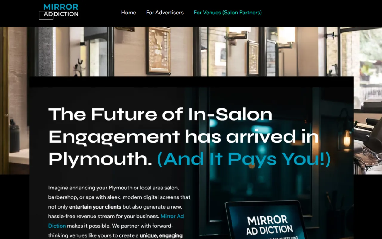 A salon mirror with a small advertising screen in its corner
